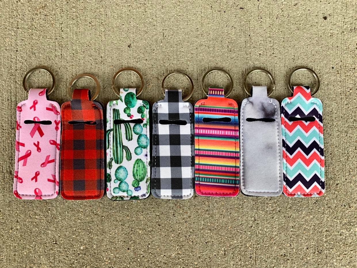 https://www.kimskornerwholesale.com/cdn/shop/files/Neoprene-Chapstick-Holders-Kim-s-Korner-Wholesale-1682525285.jpg?v=1682525287